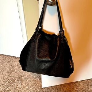 Coach pebbled leather and suede hobo bag.